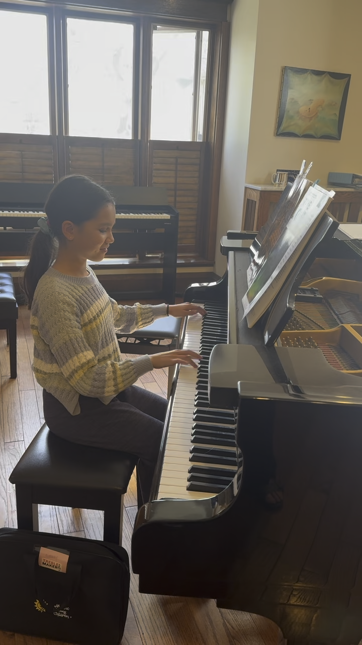 Student practicing piano during a private lesson at Musica Music School in Toronto